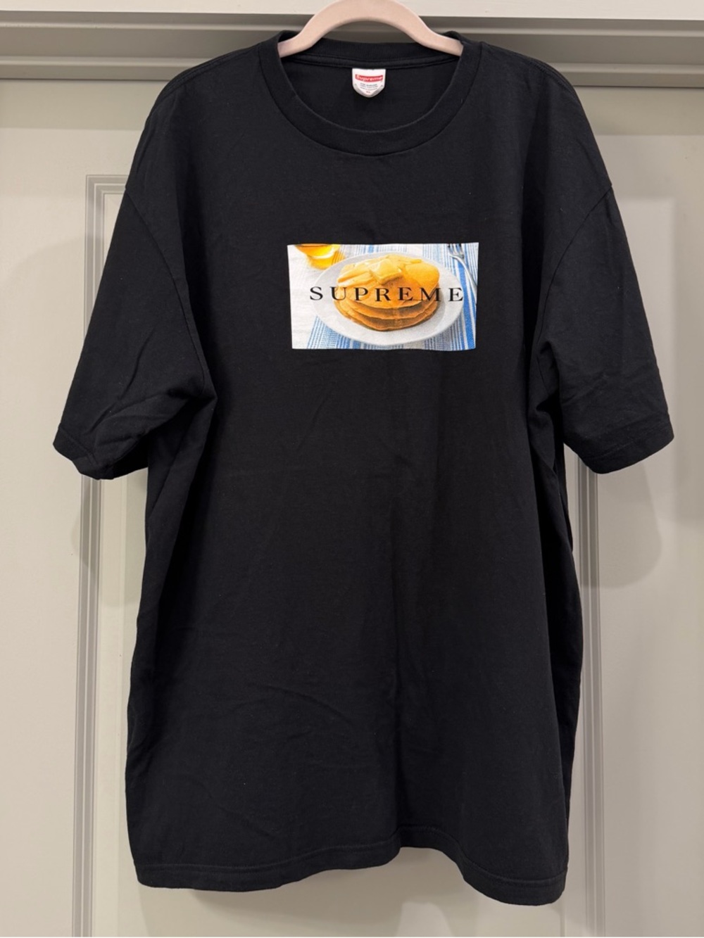 Supreme Black T-Shirt with Red Label Tag